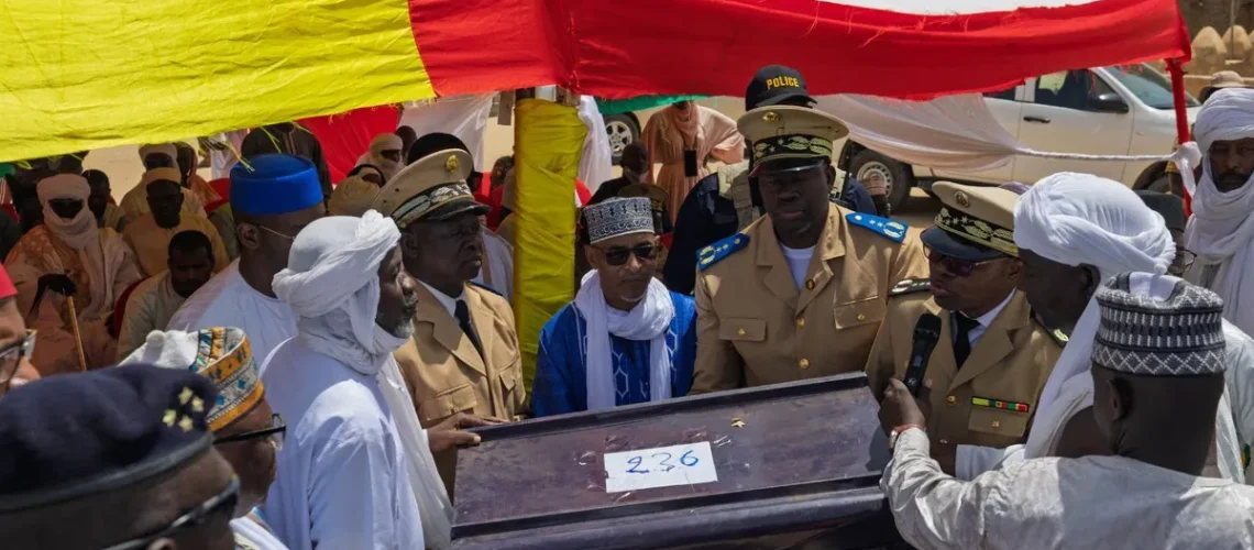 a-group-of-men-including-some-in-military-uniform-gather-around-a-brown-trunk-with-the-number-236-on-it